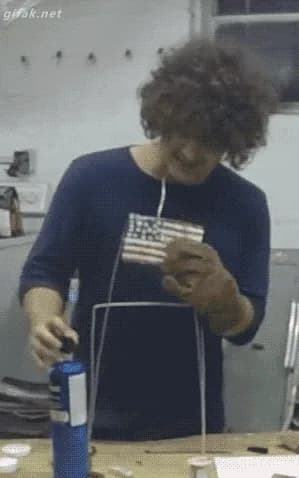 Guy casually lights hair on fire without realizing it — fail moment
