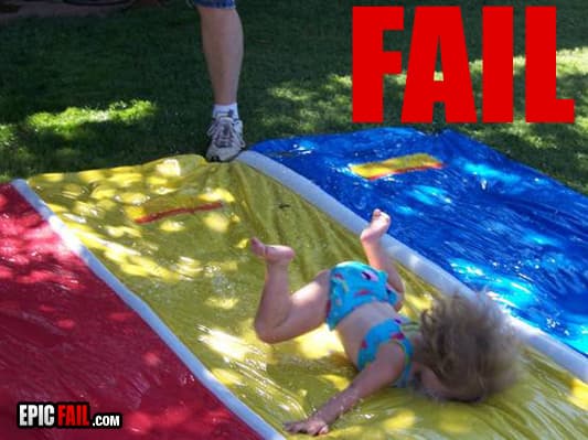 Little girl faceplants on slip and slide — fail moment
